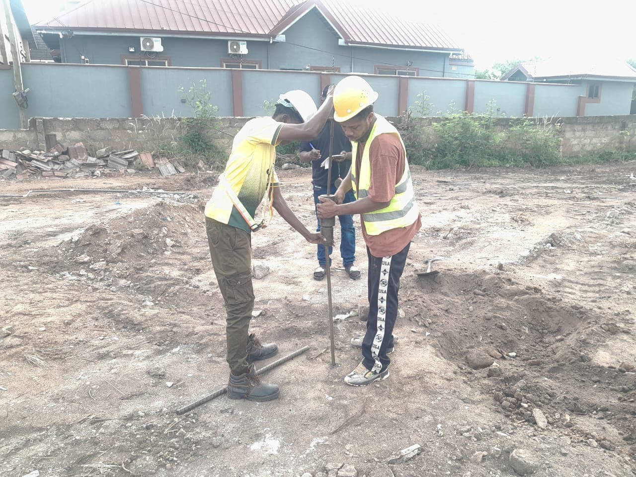 Jodorf site team carrying out setting-out works on the cleared Kutunse plot